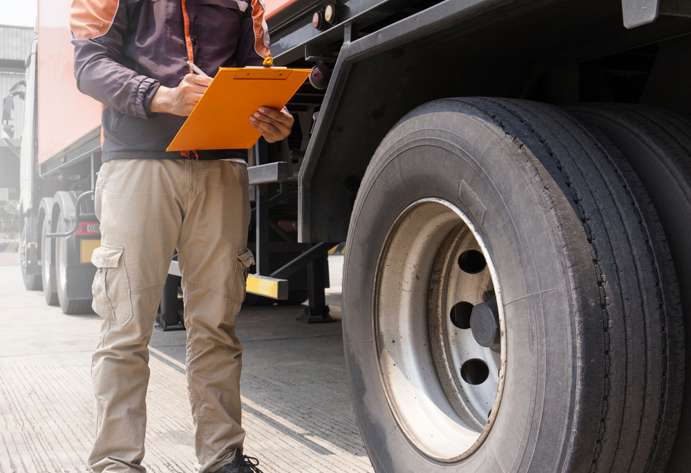 truck with side guards being inspected